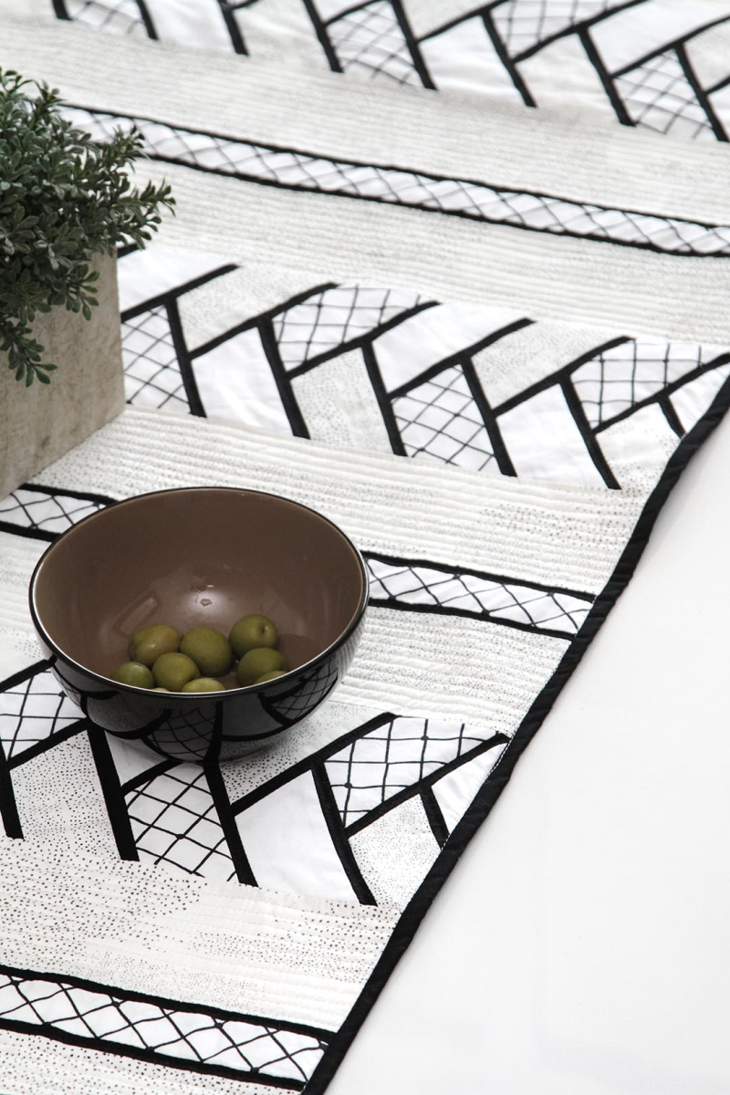 Capsules Raise the Volume Table Runner 3